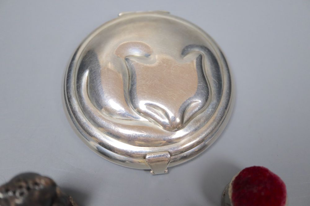 A Tiffany sterling silver circular cat compact, a white metal teddy bear pepper and a pewter teddy bear pin cushion